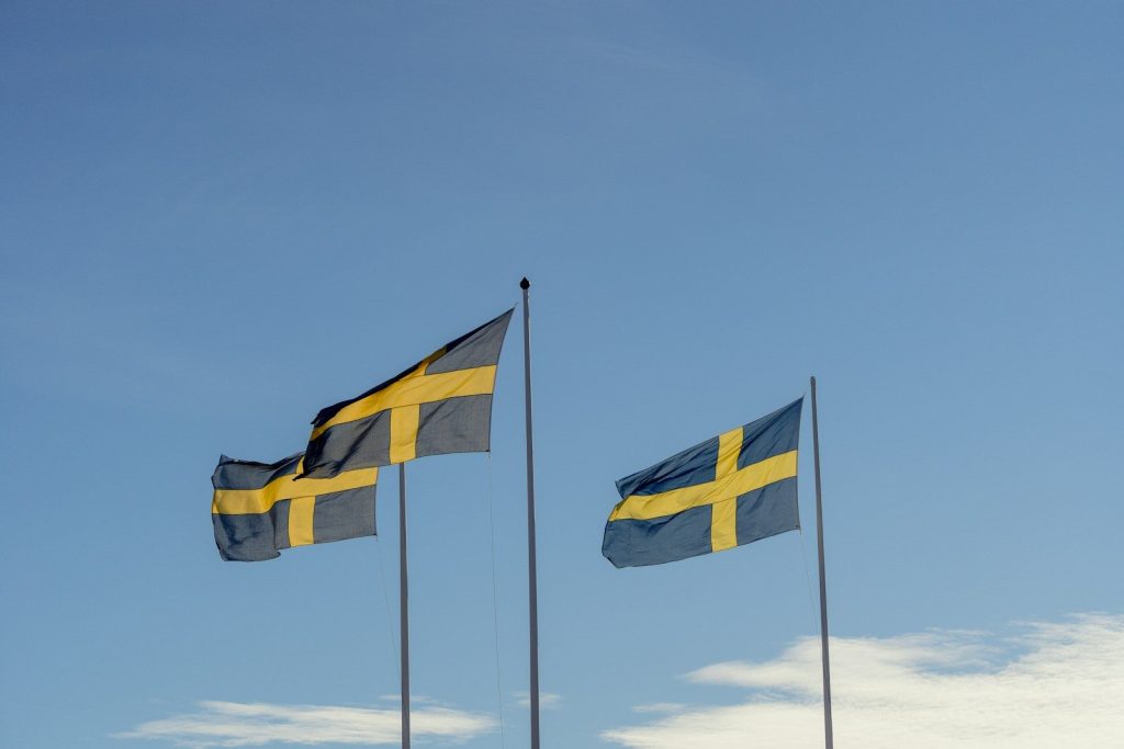 a few flags flying in the air