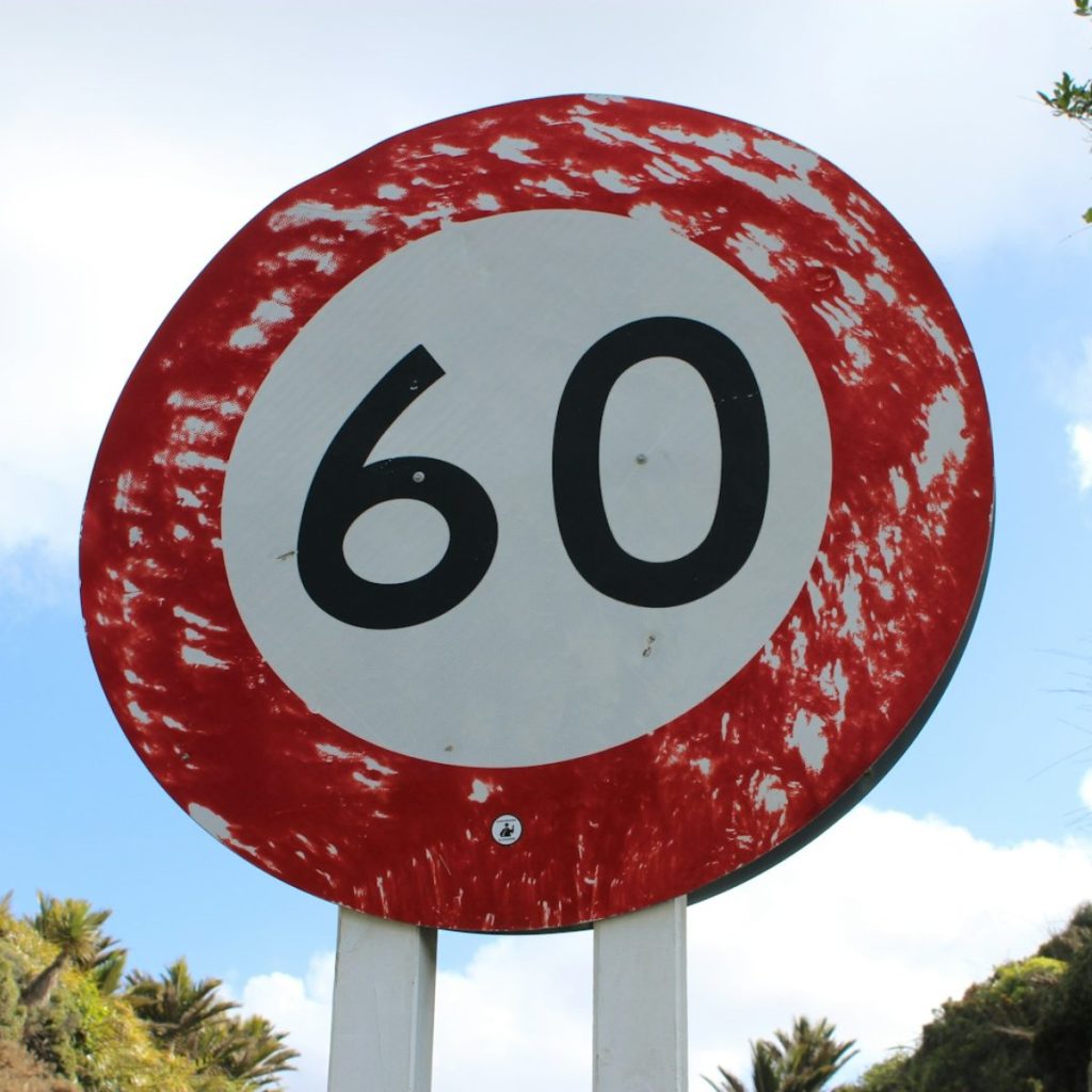 red and white round sign